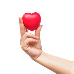 hand holding a red heart on white background