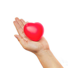 hand holding a red heart on white background