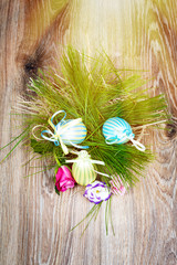 Easter eggs with flowers on wooden background. Toned image