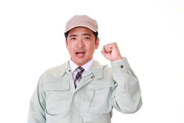 ガッツポーズの作業員

