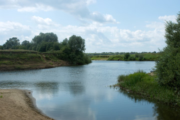 Fototapeta na wymiar A small river on a quiet summer day