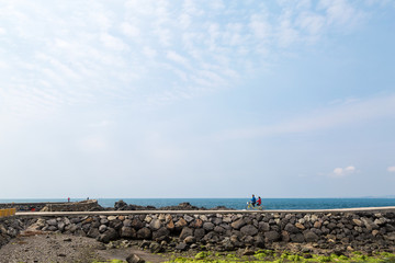 Riding a bicycle in the ocean view