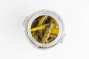 Hot Small Marinated Peppers In Jar On White Background Closeup Top View