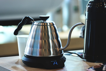 Electric kettle for brewing coffee with a long spout