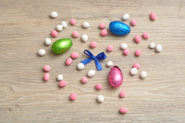 A variety of easter eggs displayed on a wooden background