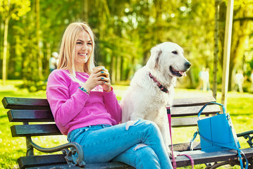 Young Woman in Park With Dog