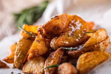 Potato. Roasted potatoes. American potatoes with salt rosemary and cumin. Roasted potato wedges delicious crispy.