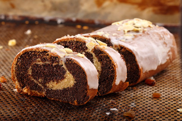 Traditional polish easter poppy cake with icing and almonds