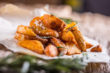 Potato. Roasted potatoes. American potatoes with salt rosemary and cumin. Roasted potato wedges delicious crispy.