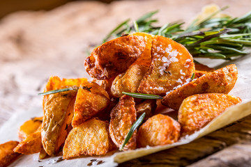 Potato. Roasted potatoes. American potatoes with salt rosemary and cumin. Roasted potato wedges delicious crispy.
