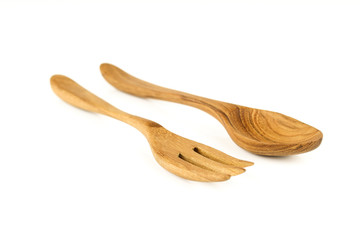 Brown wooden spoon and fork isolated on white background