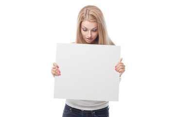 Beautiful blond girl holding blank poster
