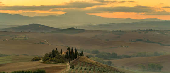 Cloudy and misty morning in the Tuscan Val d'Orcia Valley, Italy