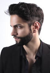 Side view portrait of  stylish young man wth a modern hairstyle 