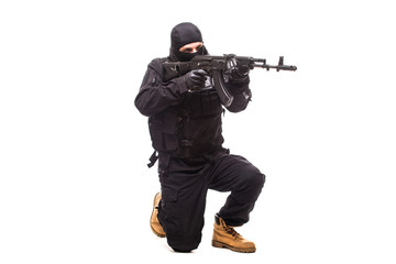 Fototapeta premium terrorist with machine gun isolated on white background