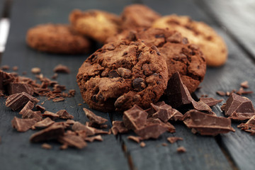 Chocolate cookies on wooden table. Chocolate chip cookies shot