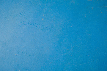 Blue metallic background with a light spot on the left