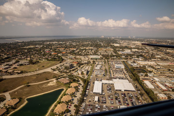 Aerial view of the metropolis Fort Myers and Cape Coral in south Florida. Typical houses with swamps and access across the channel to the sea. Florida. USA