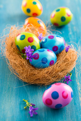 Colorful Easter eggs with spring flowers