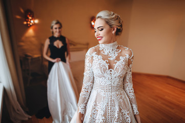 Young beautiful bride happily smiling. Wedding preparations.