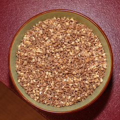 Top View of Barley and Pearl Barley inside Bowl on Red Table