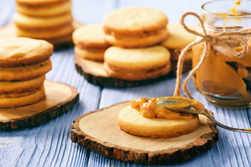Caramel shortbread cookies on wooden background.