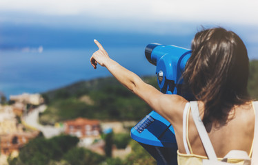Hipster tourist look observant binoculars telescope on panoramic view, traveler with backpack on...