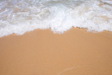 Fototapeta na wymiar Wave on the sand beach background.