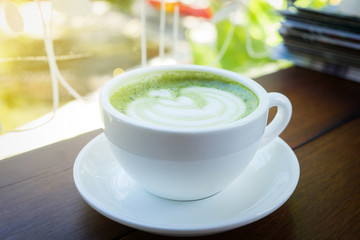 Close up of Coffee cup in relax time on blur coffee shop background.