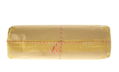 Parcel wrapped with brown kraft paper isolated on white background.