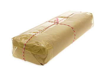Parcel wrapped with brown kraft paper isolated on white background.