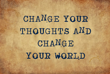 Inspiring motivation quote of change your thoughts and change your world with typewriter text. Distressed Old Paper with Typing image.