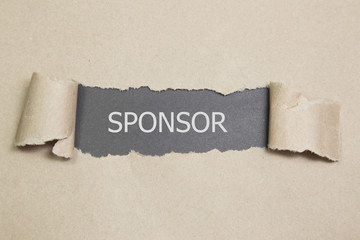 sponsor written under torn paper,  sponsorship concept. - obrazy, fototapety, plakaty