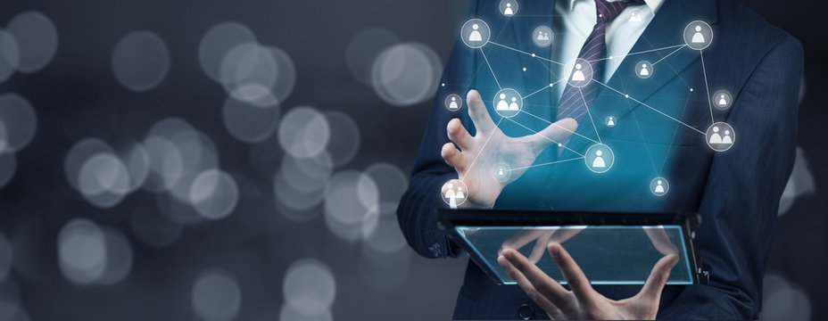 Businessman  hand tablet with  virtual social media buttons