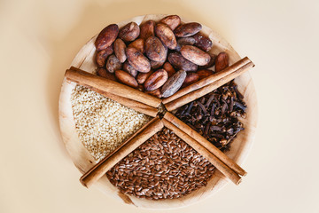 healthy food, cocoa beans, cinnamon sticks, sesame