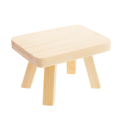Wooden toy table isolated on white background.