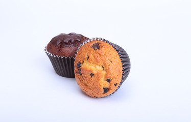Fresh homemade muffins on white background. Top view.