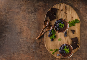 Chocolate pudding with berries and herbs