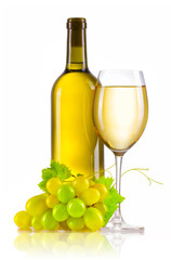Glass of white wine with bottle and ripe grapes isolated