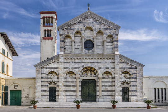 The beautiful facade of the church Chiesa di Santa Maria Ausiliatrice, Marina di Pisa, Tuscany, Italy