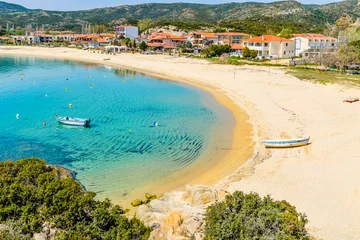 Summer day in Kalamitsi beach. Colorful Greek fishing boats in the natural bay. Typical Greek landscape from Kalamitsi, Sitonia, Halkidiki, Macedonia, Northern Greece. © bobiphil