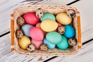 Top view of egg basket. Bright Easter eggs.