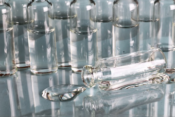 transparent vials of medicine