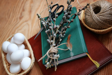 willow and egg on a wooden background