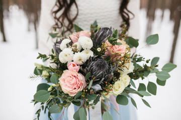 The bride holds a wedding bouquet. Beautiful wedding bouquet

