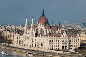 Cityscape of Budapest with hungarian parliament building on Danube river seen from the Buda side on a sunny day