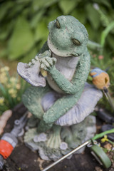 garden sculpture Frog on the background of country house