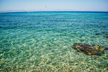 Blue sea and sharp rocks that surround it