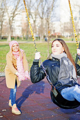 Two teens hang out at the playground