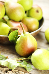 Ripe pears on grey wooden table